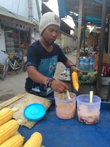 Buttering grilled corn