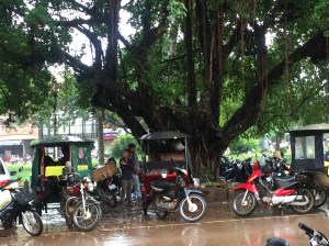 Tuk Tuk drivers waiting in the rain