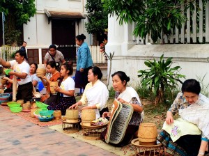 People giving food to the monks