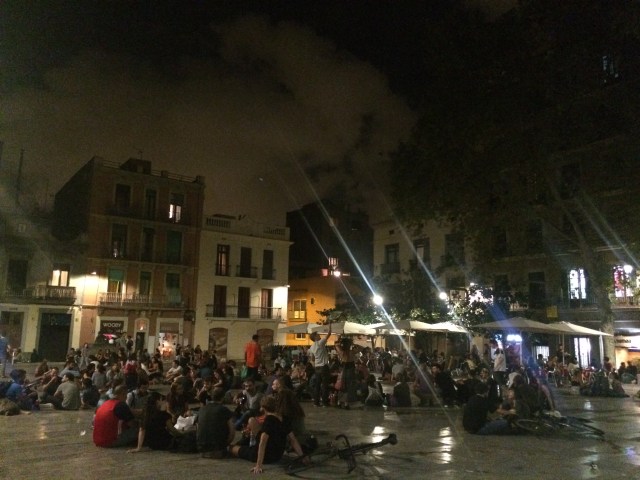People sitting in the placa on Thursday evening at 11:30pm
