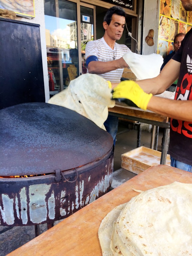 Making laffa (a thick, flat bread wrap that is larger than a regular pita)